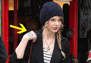 Taylor Swift Wears Her Lucky Number 13 painted On Her Hand
