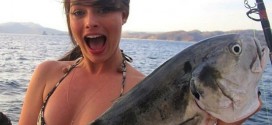 Margot Robbie holding a giant fish