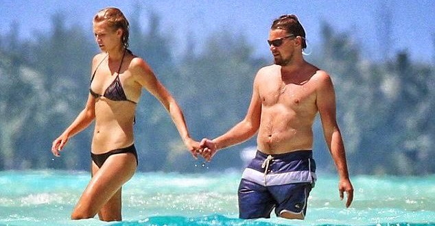 DiCaprio Kisses Model Girlfriend as She Goes Topless On Beach Holiday