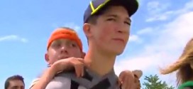 Teen finishes 40-mile walk while carrying brother