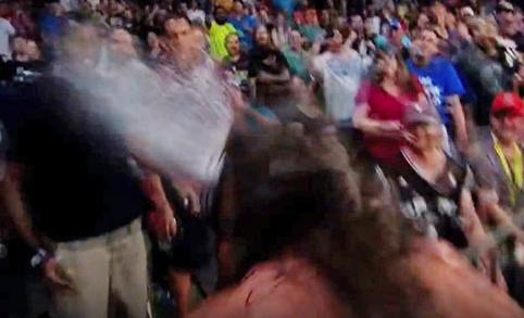Wrestler spits beer in face of Cowboys DE George Selvie