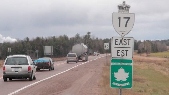 One dead, part of Hwy 17 closed after truck loses load of logs