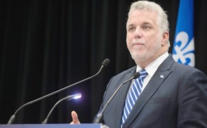 Premier Couillard raked over coals for not speaking French in Iceland