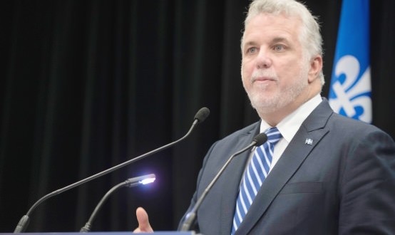 Premier Couillard raked over coals for not speaking French in Iceland