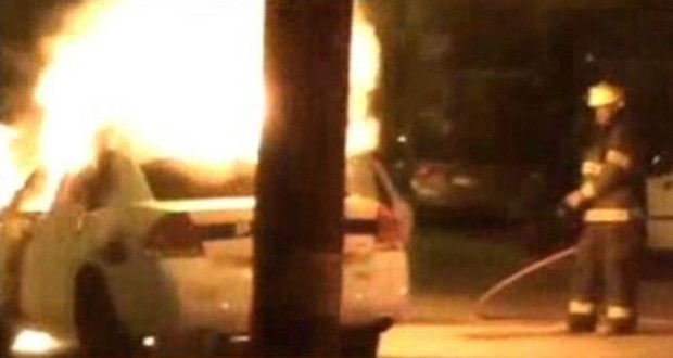Teen saves cop from burning car (Video)