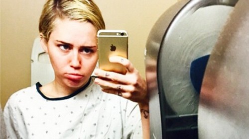 Miley Cyrus Hospitalized : Singer worries fans by posting sad selfies in a hospital gown