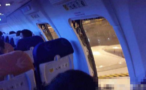 Chinese Passengers open plane door ahead of take off