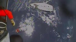 Coast Guard rescues father, son in high seas (Video)