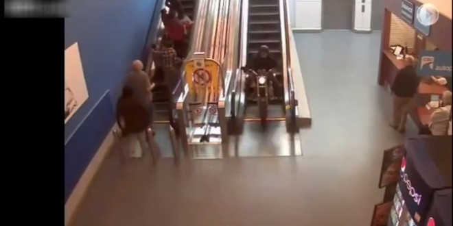 Biker zooms down Surrey mall escalator (Video)