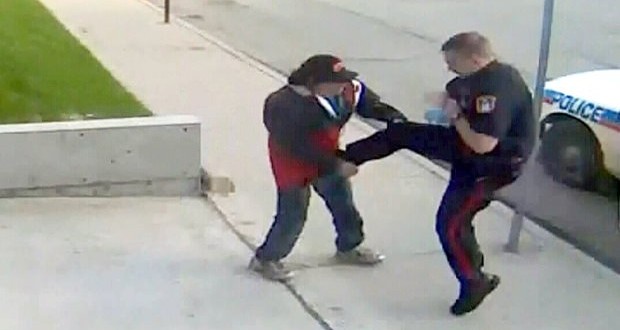 Judge releases footage of cop kicking homeless man (Video)