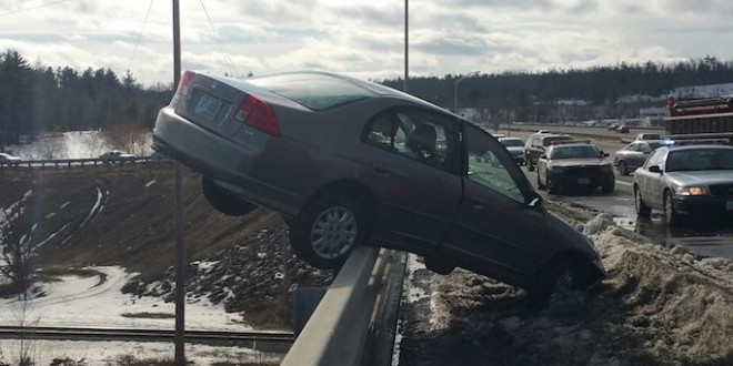 Teen's car teeters : Colin Malone escapes car hanging off bridge over NH river