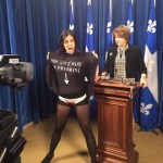 Topless woman disrupts Quebec news conference (Video)