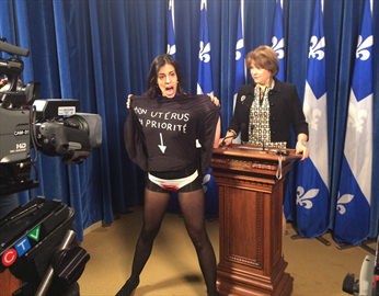 Topless woman disrupts Quebec news conference (Video)