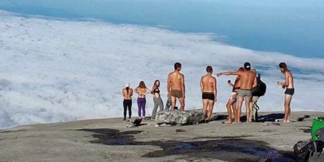 Woman On Mountain Malaysia detains 2 Canadians among 4 Westerners for alleged naked pose on mountain photo1