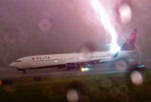 Lightning Bolt Strikes Delta Airliner : Video captures plane on runway getting struck by lightning