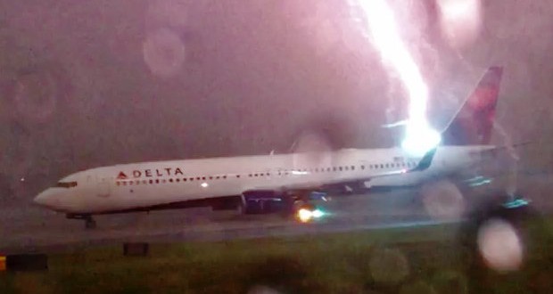 Lightning Bolt Strikes Delta Airliner : Video captures plane on runway getting struck by lightning