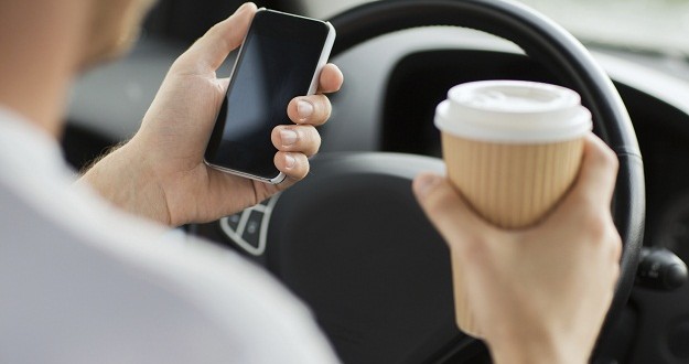 Demerits coming for Alberta distracted drivers, Report