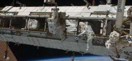 US Astronauts fix stalled rail car during spacewalk