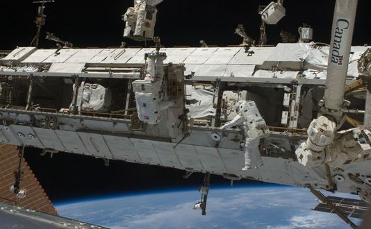 US Astronauts fix stalled rail car during spacewalk