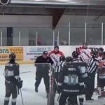 Linesman punches player, gets tackled by trainer (Video)