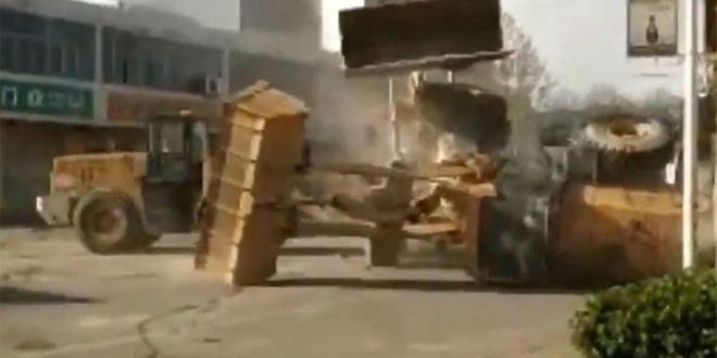 Bulldozers battle on northern China streets “Video”