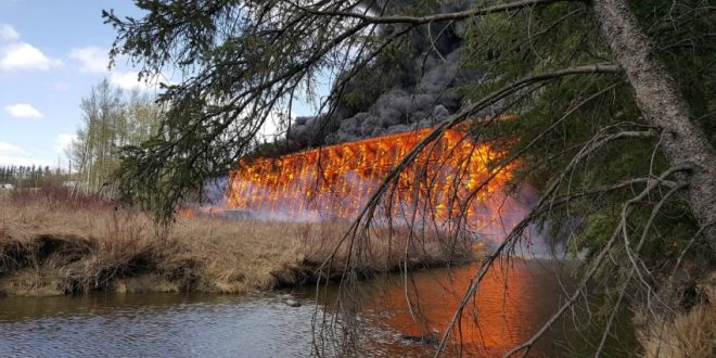 CN trestle bridge in flames at Mayerthorpe, Alta. (Video)