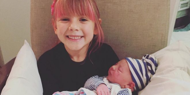 Pink Posts Adorable Photo Of Willow Holding Jameson