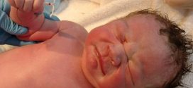 Baby born clutching his mother's birth control coil (Photo)